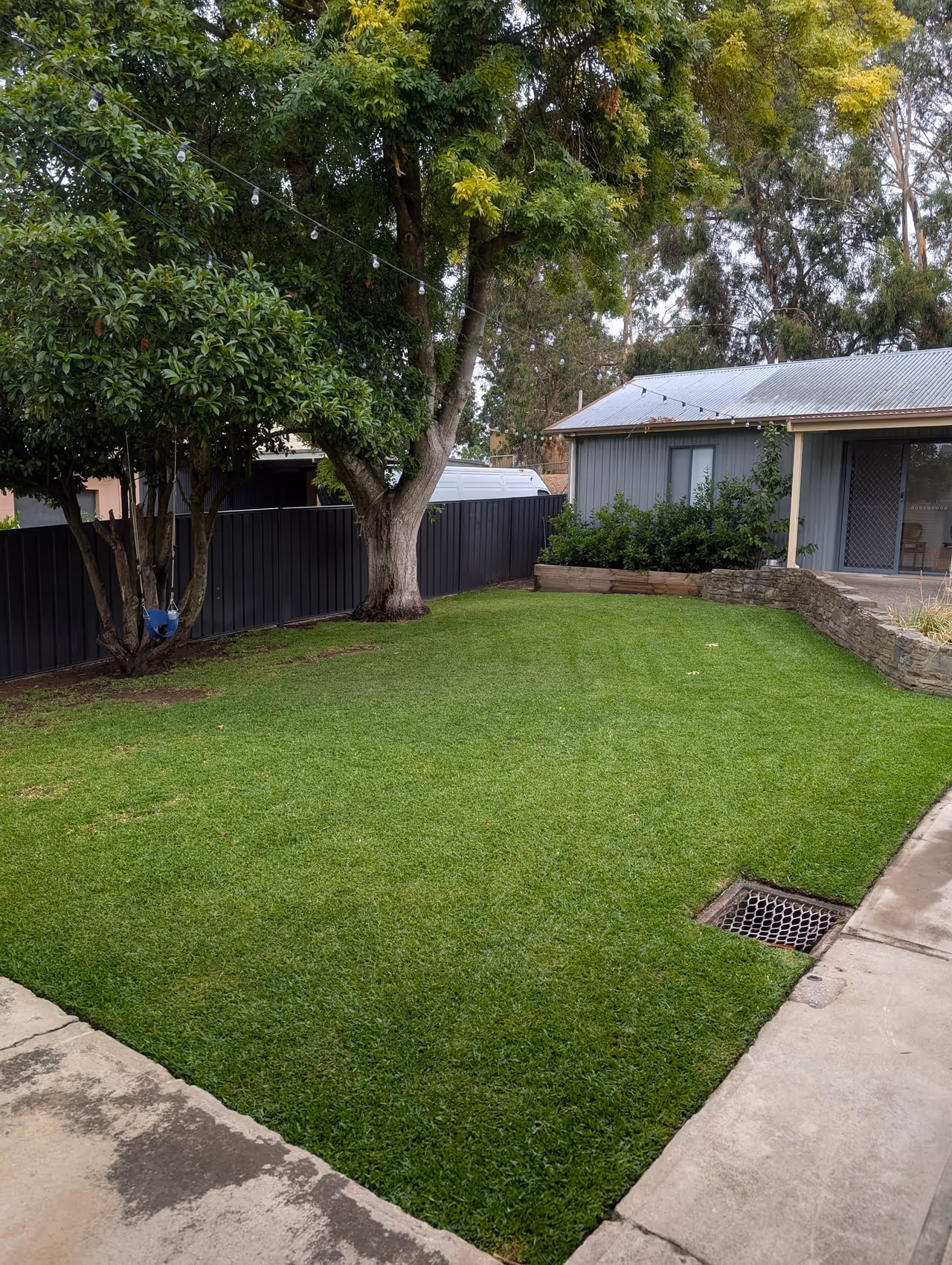 Freshly mowed and edged residential lawn at an Adelaide property maintained by Green & Clean