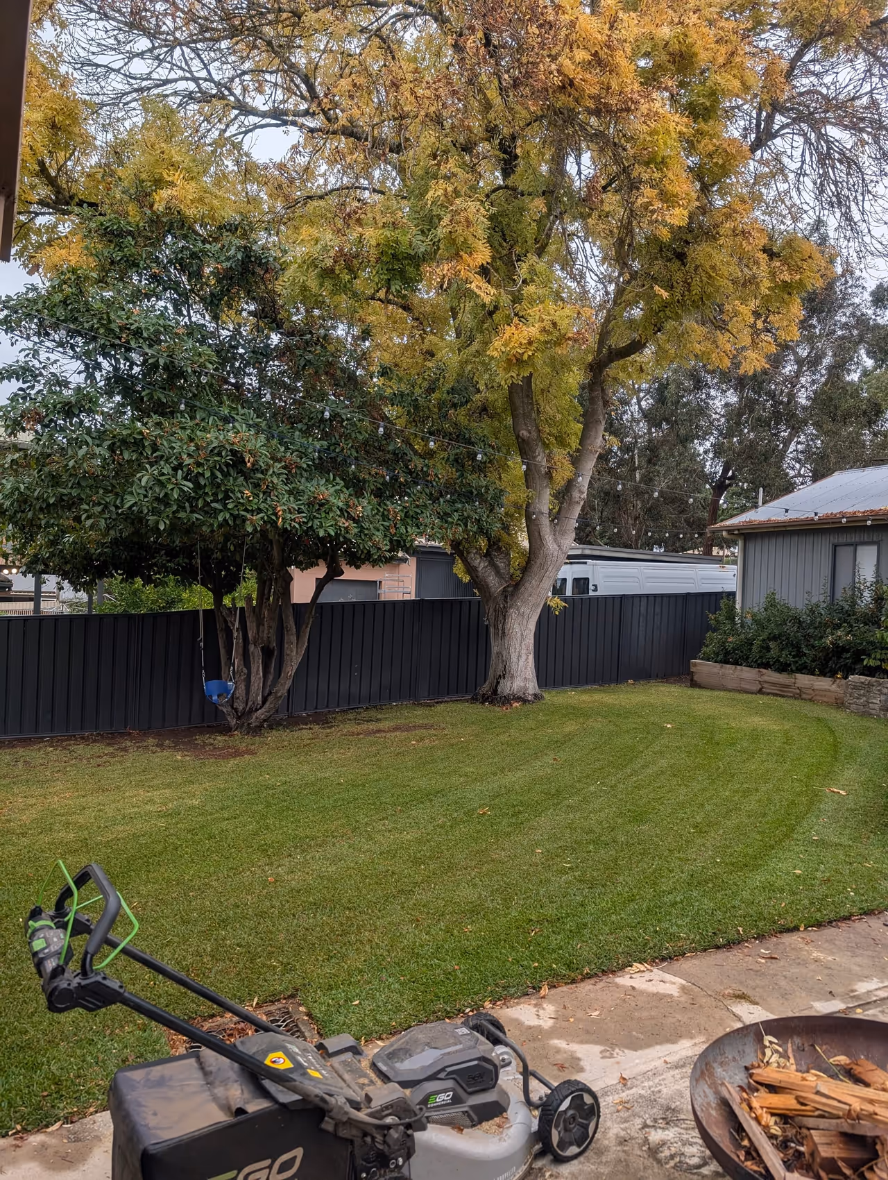Strata lawn with even mowing stripes after a scheduled maintenance visit